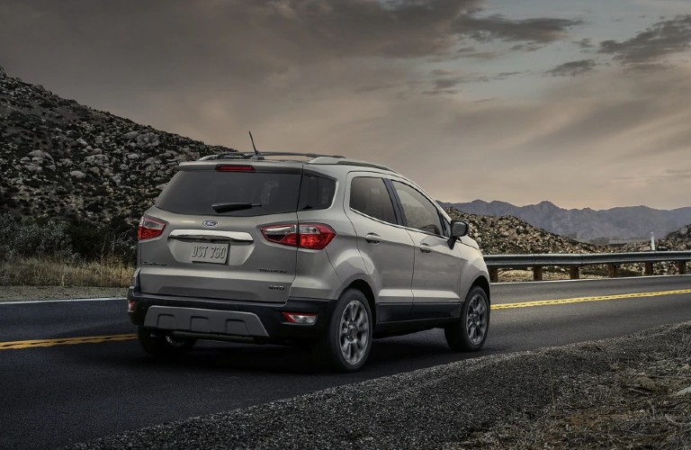 A silver 2021 Ford EcoSport on the road during sunset