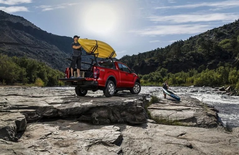 Red Ford Ranger Carrying a kayak