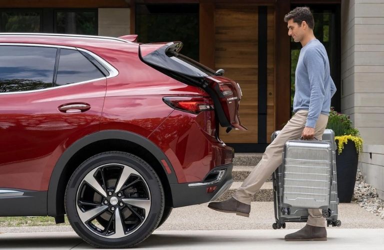A man using the power liftgate feature in the 2021 Buick Envision.