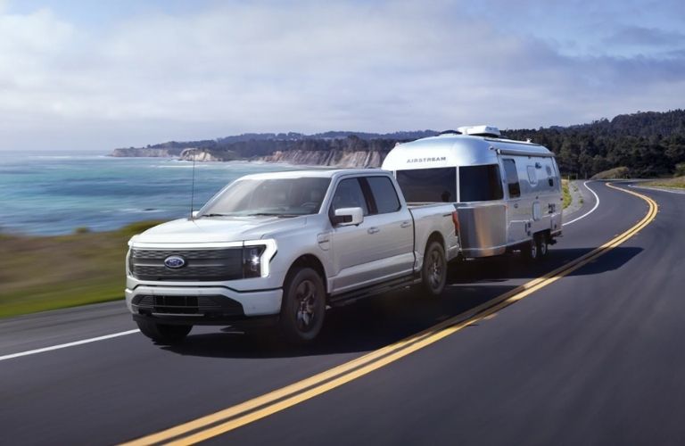 front view of the 2022 Ford F-150 Lightning towing a trailer