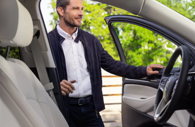 A man entering the 2022 Buick Enclave