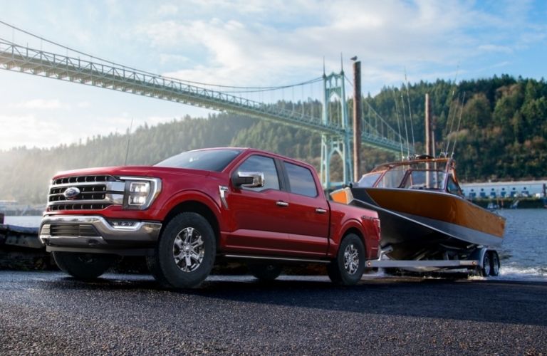 side view of the 2022 Ford F-150® Truck pulling a boat