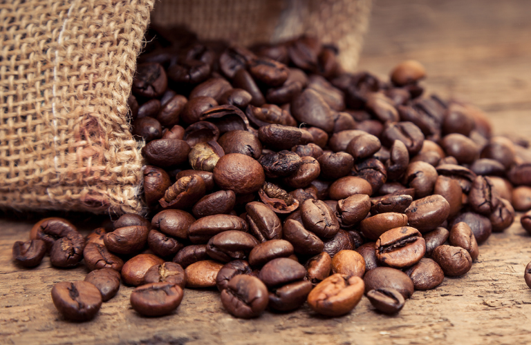 Coffee beans coming out of a bag