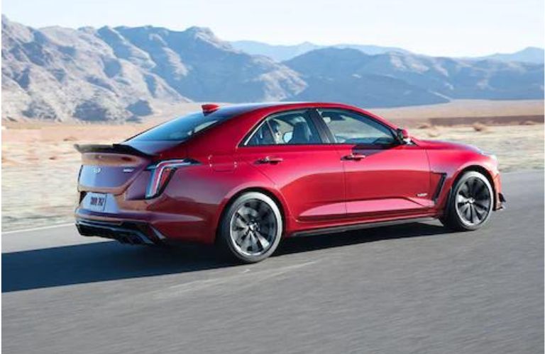 2022 Cadillac CT4 in red driving on road