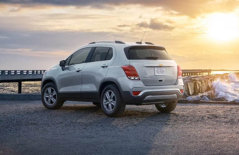 Rear view of the 2022 Chevrolet Trax parked on a beach side