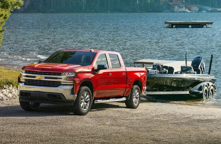 2022 Chevy Silverado pulling out a boat from a lake