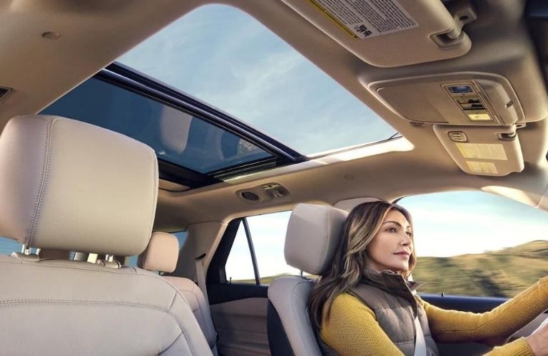 A woman driving the 2022 Ford Explorer.