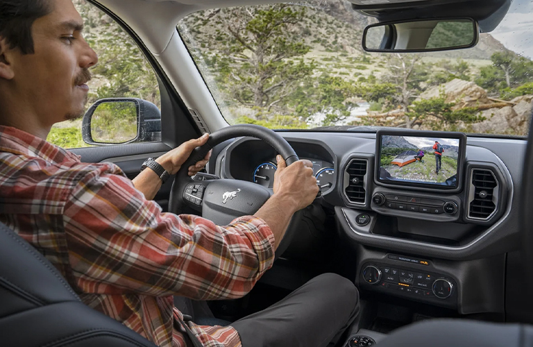 A man driving the 2022 Ford Bronco Sport. 