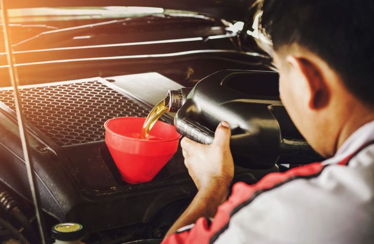 Mechanic changing a vehicle's oil