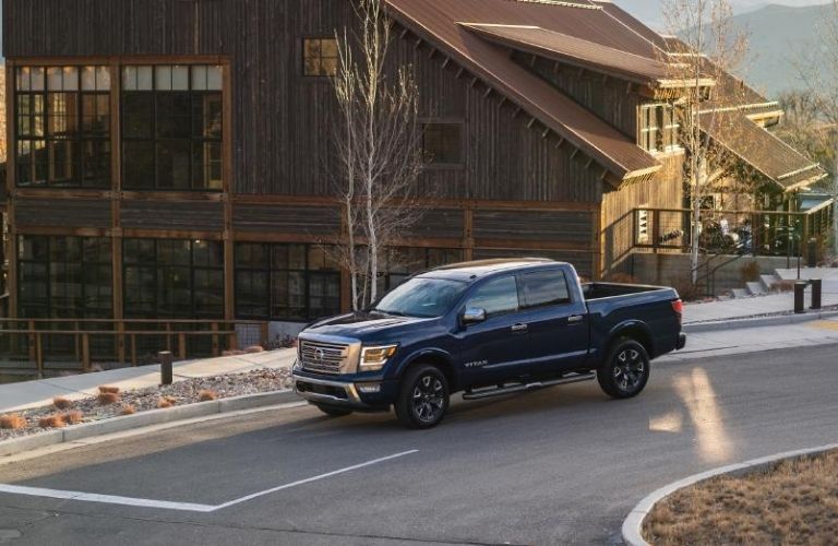 A 2021 Nissan Titan descending a sloped road