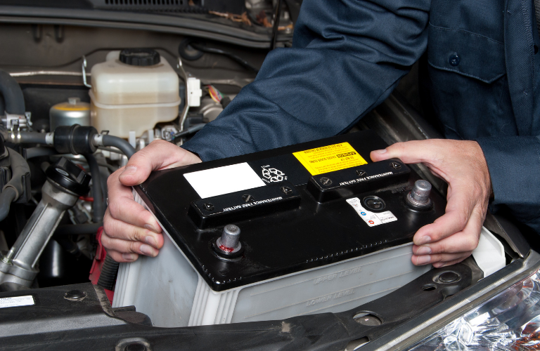 Mechanic checking a battery