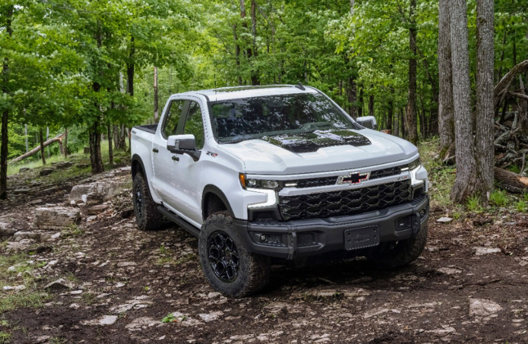 Front view of the 2024 Chevrolet Silverado on a rough terrain 