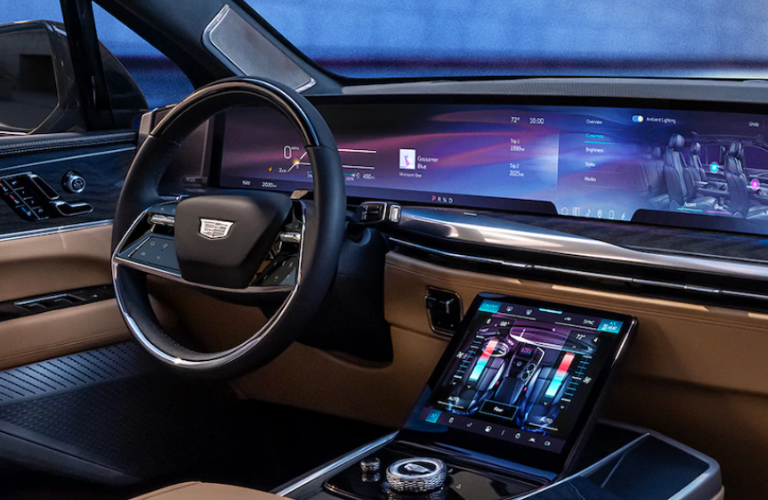 A close up of the 2025 Cadillac ESCALADE IQ steering wheel and touchscreen 