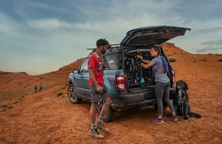 two people loading luggage in the 2024 Ford Bronco® Sport