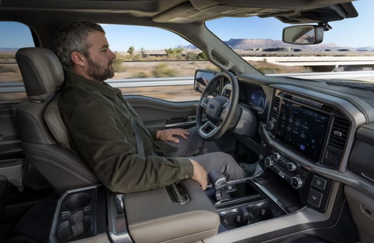 side veiw of a driver using handsfree highway driving in the 2024 Ford F-150