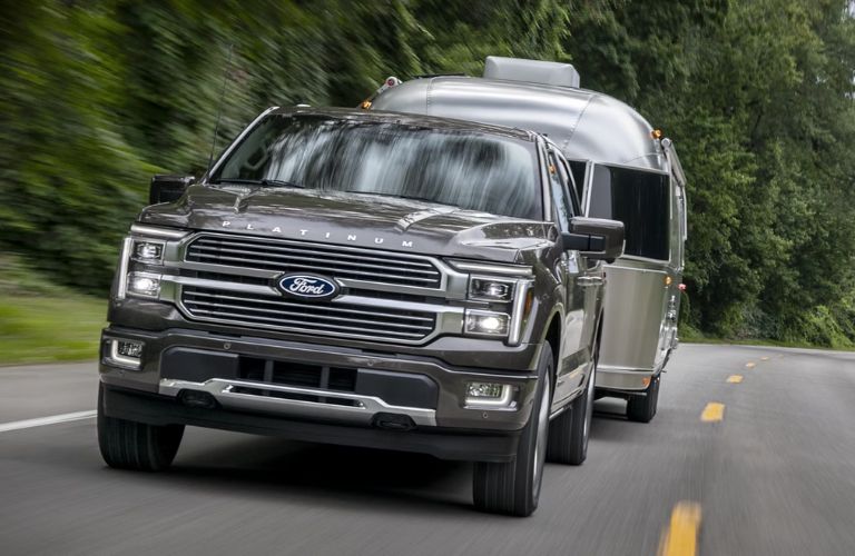 2025 Ford F-150® exterior front view with a trailer
