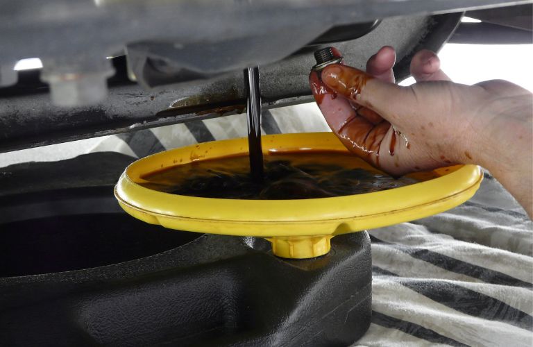 Hand of a mechanic working on a vehicle
