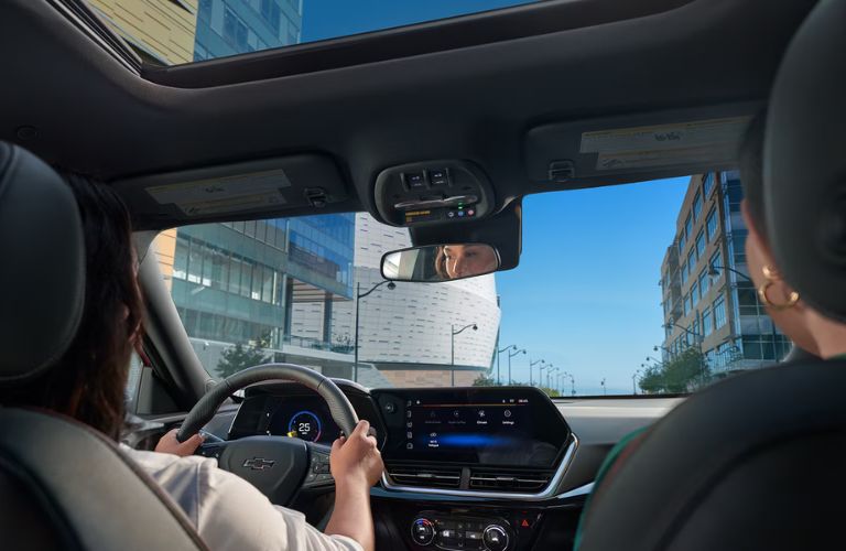 Two woman driving the 2025 Chevrolet Trax
