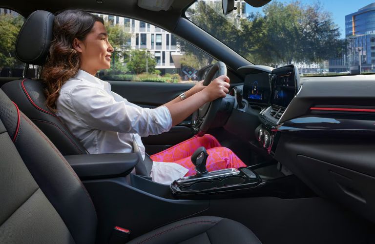 A woman driving the 2026 Chevrolet Trax